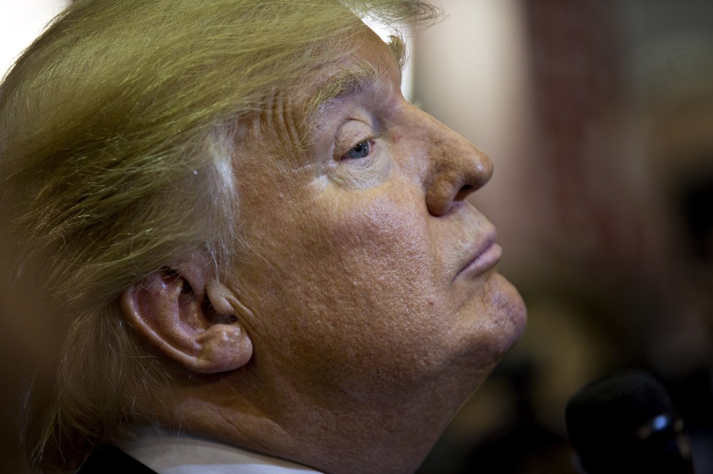 Donald Trump listens to a question while speaking to members of the media in the spin room after the Republican presidential primary candidate debate at the University of Houston in Houston, Texas, Feb. 25, 2016. (Photo by Andrew Harrer/Bloomberg/Getty)