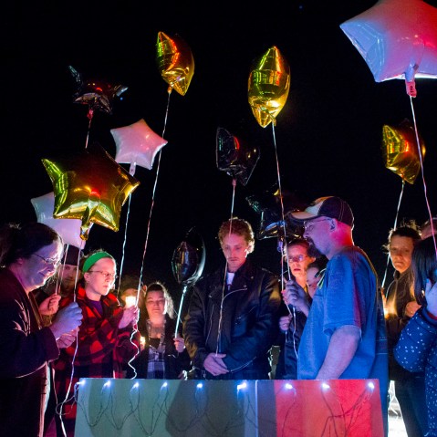 Family and friends hold a candle light vigil on Hesston Road for shooting victim Brian Sadowsky outside the Excel Industries plant on Feb. 26, 2015 in Kansas. (Photo by Kyle Rivas/Getty)