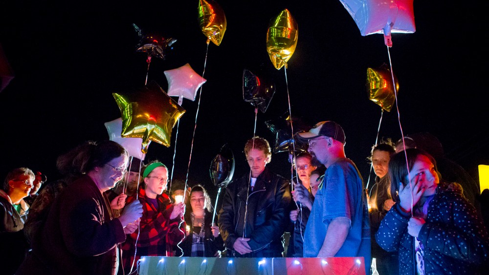 Family and friends hold a candle light vigil on Hesston Road for shooting victim Brian Sadowsky outside the Excel Industries plant on Feb. 26, 2015 in Kansas. (Photo by Kyle Rivas/Getty)