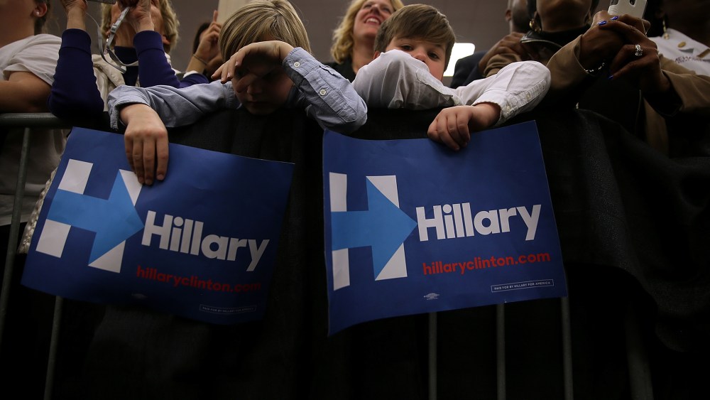 Young supporters hold signs as Hillary Clinton speaks during a "Get Out The Vote" event at Meharry Medical College on Feb. 28, 2016 in Nashville, Tenn. (Photo by Justin Sullivan/Getty)
