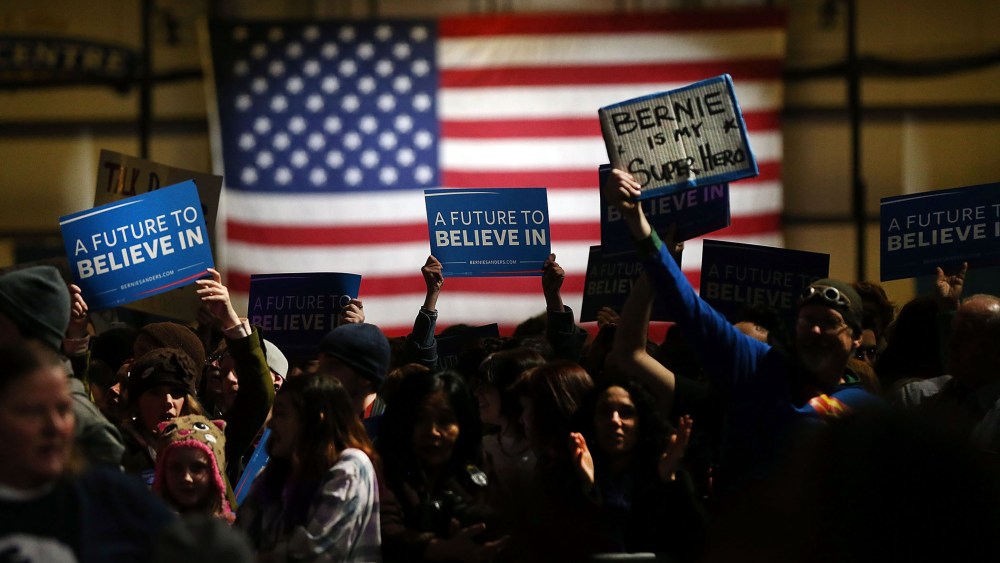 Supporters of Democratic presidential candidate, Sen. Bernie Sanders (D-VT) wait for his arrival on stage at the Champlain Valley Exposition March 1, 2016 in Essex Junction, Vt. (Photo by Spencer Platt/Getty)