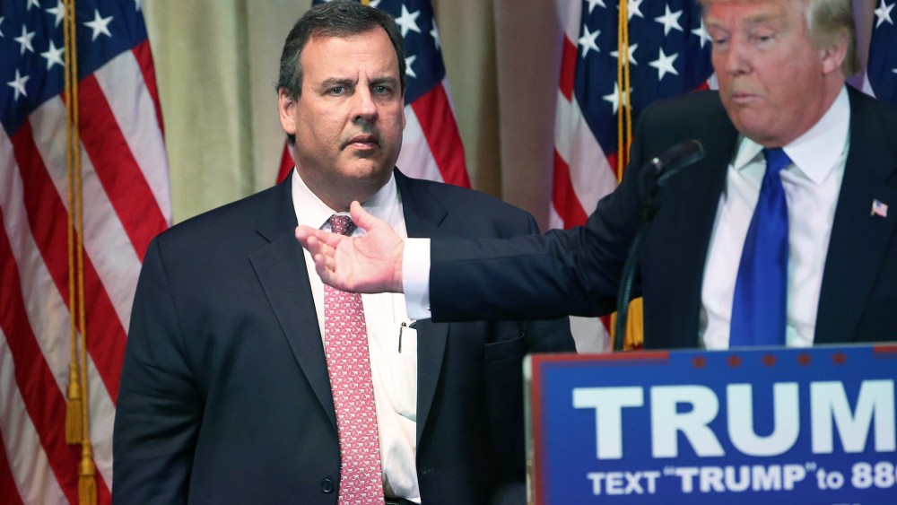 New Jersey Governor Chris Christie accompanies Republican Presidential frontrunner Donald Trump off the stage after a press conference on March 1, 2016 in Palm Beach, Fla. (Photo by John Moore/Getty)