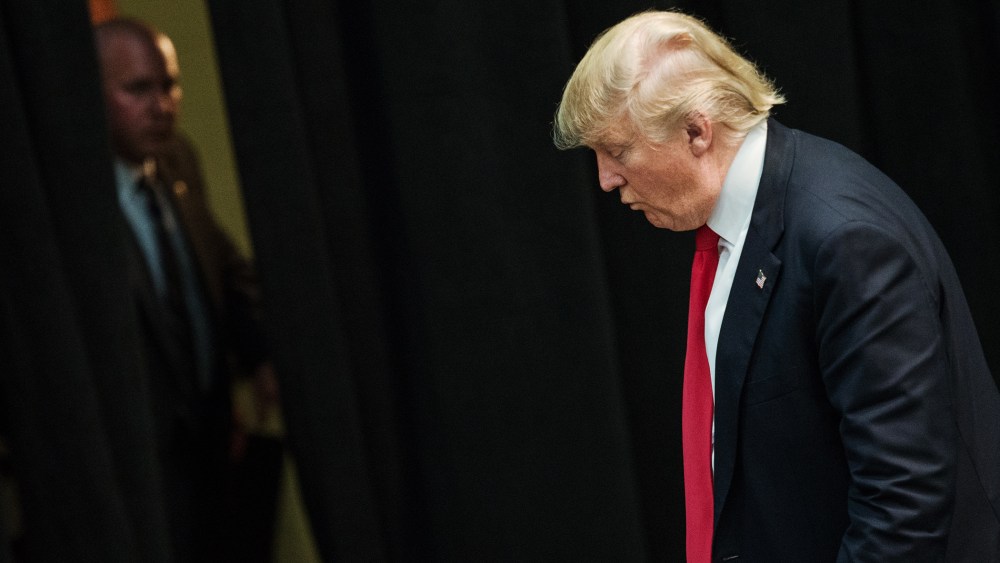 Republican presidential candidate Donald Trump makes his way to an exit at a campaign rally March 7, 2016 in Concord, N.C. (Photo by Sean Rayford/Getty)