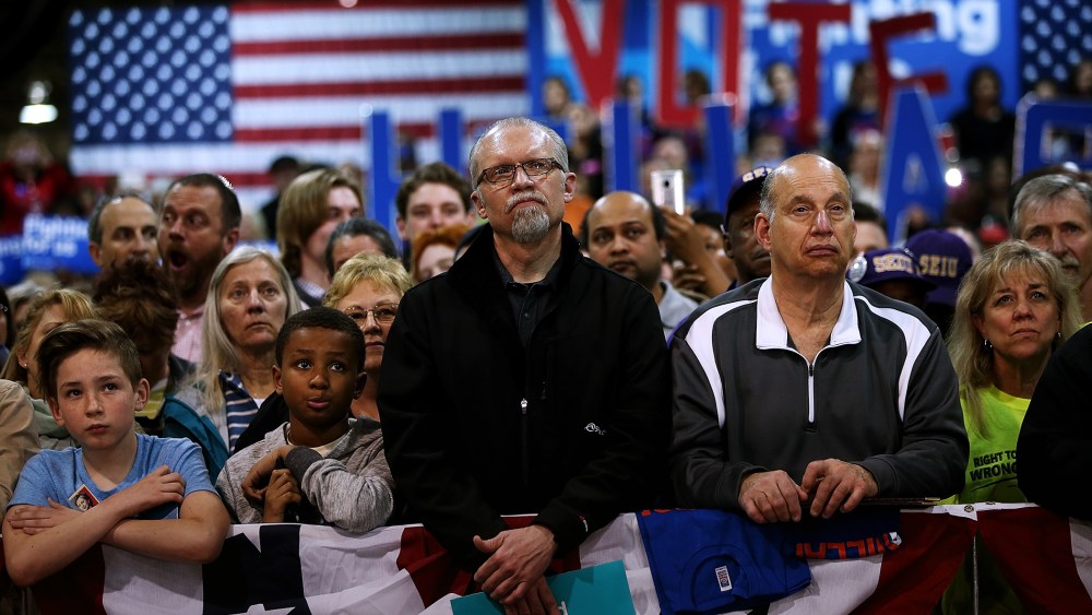 Supporters look on as Hillary Clinton speaks during a Get Out the Vote event at the Nelson-Mulligan Carpenters' Training Center on March 12, 2016 in St Louis, Mo. (Photo by Justin Sullivan/Getty)