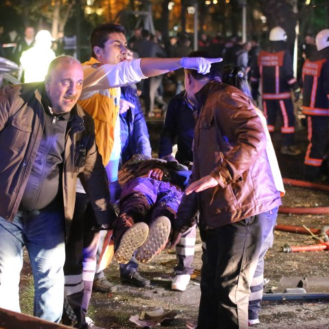 Rescuers carry a victim on a stretcher at the scene of a blast in Ankara on March 13, 2016. At least 27 people were killed and 75 others wounded in a blast in the heart of the Turkish capital Ankara. (Photo by Erol Ucem/AFP/Getty)