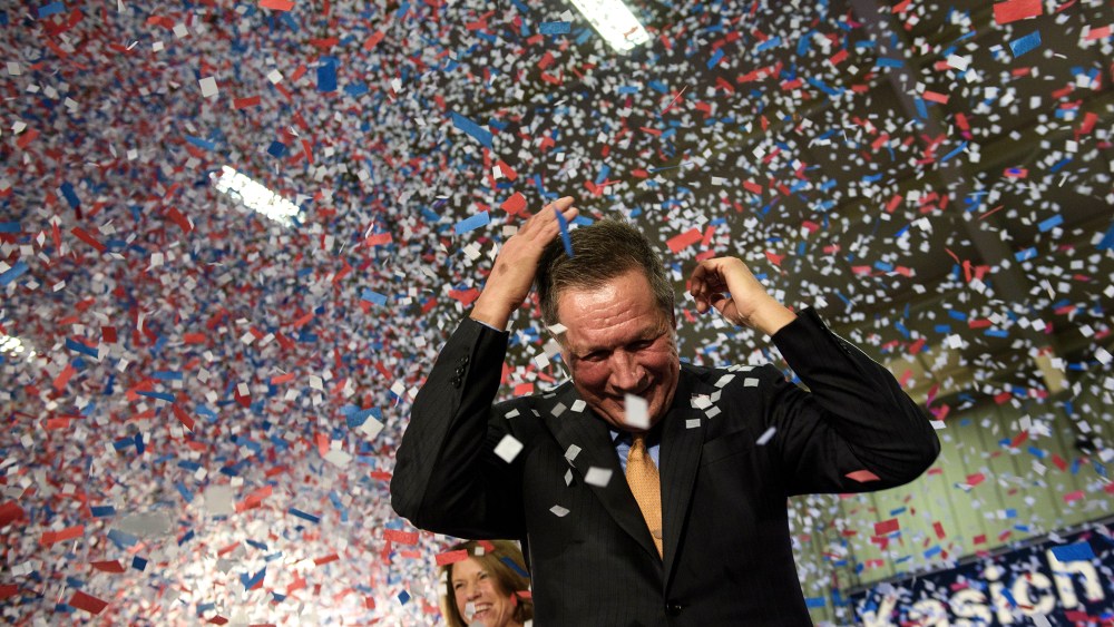 Republican Presidential hopeful Ohio Governor John Kasich celebrates his Ohio primary victory during voting day rally at Baldwin Wallace University March 15, 2016 in Berea, Ohio. (Photo by Brendan Smialowski/AFP/Getty)