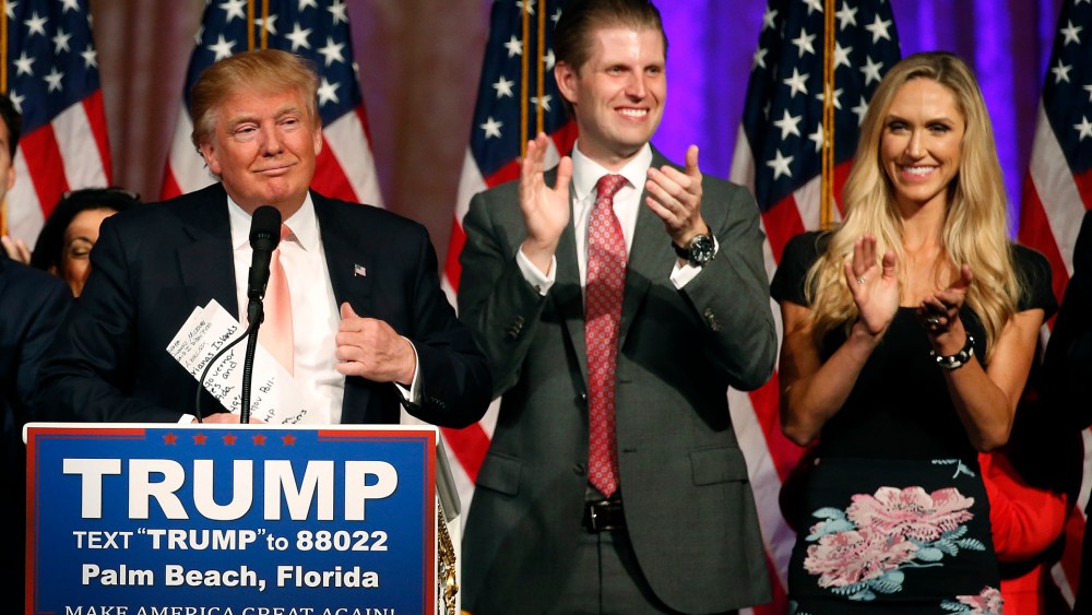 Republican presidential candidate Donald Trump (L), with his son Eric Trump and daughter-in-law, Lara Trump, addresses the media following victory in the Florida state primary on March 15, 2016 in West Palm Beach, Fl. (Photo by Rhona Wise/AFP/Getty)