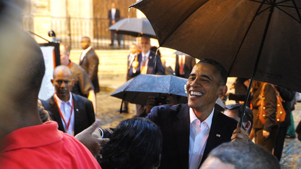 President Obama talks to tourists and Cubans at his arrival to the Havana Cathedral, on March 20, 2016. (Photo by Yamil Lage/AFP/Getty)