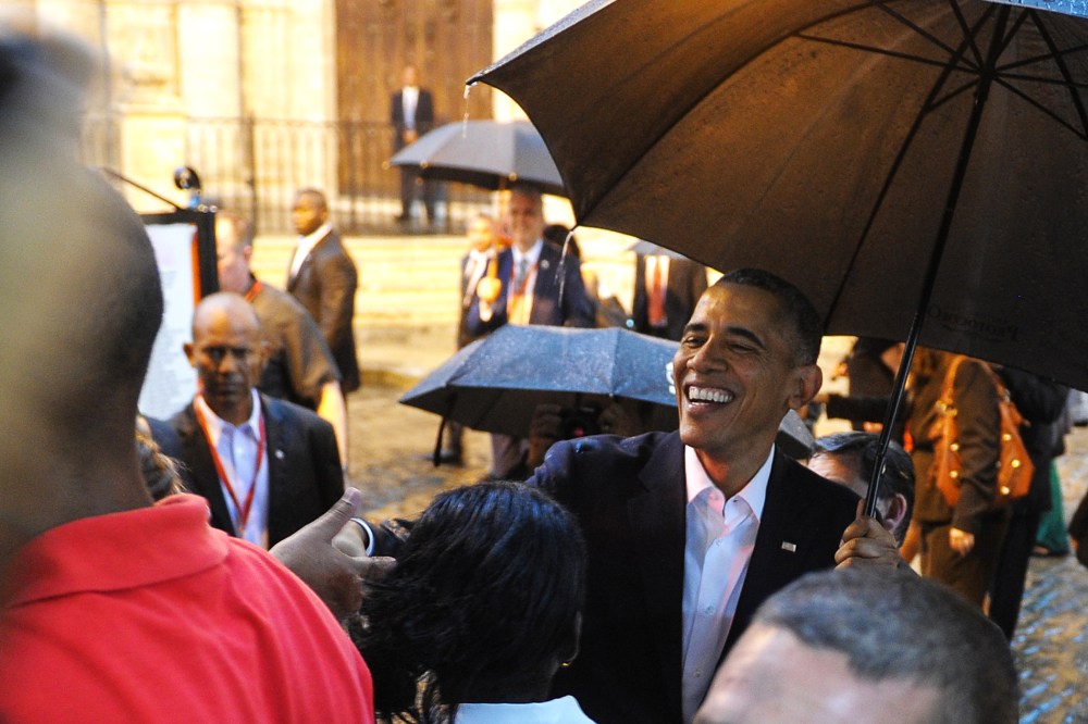 President Obama talks to tourists and Cubans at his arrival to the Havana Cathedral, on March 20, 2016. (Photo by Yamil Lage/AFP/Getty)