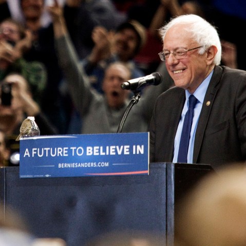 A bird lands on Democratic presidential candidate Bernie Sanders podium as he speaks on March 25, 2016 in Portland, Ore. (Photo by Natalie Behring/Getty)