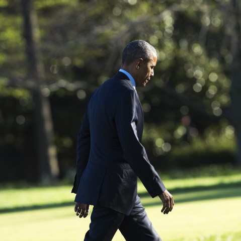 President Barack Obama walks across the South Lawn after arriving on Marine One at the White House in Washington, D.C., March 29, 2016. (Photo by Saul Loeb/AFP/Getty)