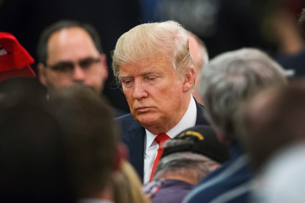 Republican presidential candidate Donald Trump greets guests following a campaign rally at the Radisson Paper Valley Hotel on March 30, 2016 in Appleton, Wis. (Photo by Scott Olson/Getty)