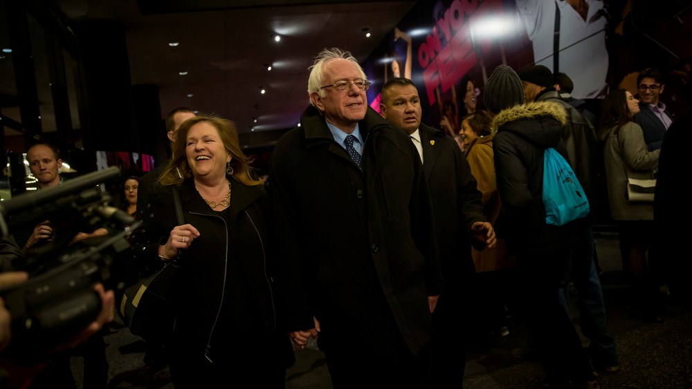 Democratic presidential candidate Sen. Bernie Sanders (D-VT) and his wife, Jane Sanders, walk through the Theatre District in Times Square, April 8, 2016 in New York City. (Photo by Eric Thayer/Getty)