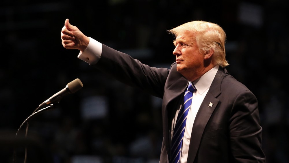 Republican presidential candidate Donald Trump gives a thumbs up to supporters after speaking at a campaign rally on April 11, 2016 in Albany, New York. (Photo by Eduardo Munoz Alvarez/Getty)