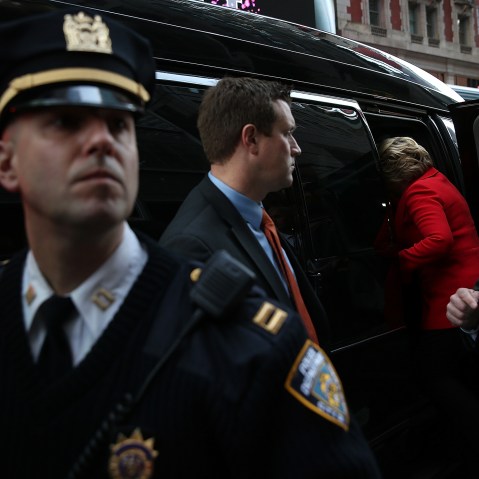 Democratic presidential candidate former Secretary of State Hillary Clinton gets into her van after visiting picketing Verizon workers outside of a Verizon store on April 13, 2016 in New York City. (Photo by Justin Sullivan/Getty)