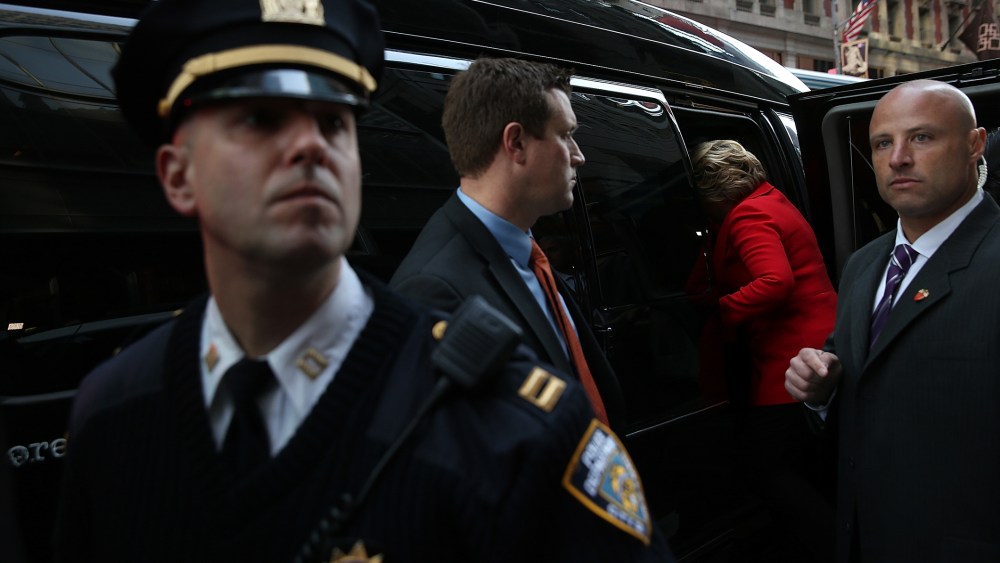Democratic presidential candidate former Secretary of State Hillary Clinton gets into her van after visiting picketing Verizon workers outside of a Verizon store on April 13, 2016 in New York City. (Photo by Justin Sullivan/Getty)