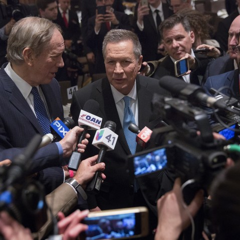 John Kasich, 2016 Republican presidential candidate, speaks to members of the media next to George Pataki, former governor of New York, during the New York State Republican Gala, April 14, 2016. (Photo by Victor J. Blue/Bloomberg/Getty)