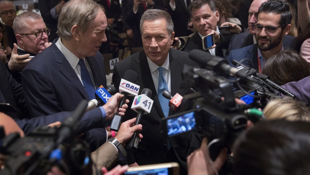John Kasich, 2016 Republican presidential candidate, speaks to members of the media next to George Pataki, former governor of New York, during the New York State Republican Gala, April 14, 2016. (Photo by Victor J. Blue/Bloomberg/Getty)