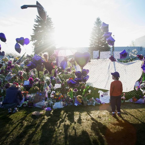 Music fans visit a memorial created outside Paisley Park, the home and studio of Prince, on April 23, 2016 in Chanhassen, Minn. (Photo by Scott Olson/Getty)