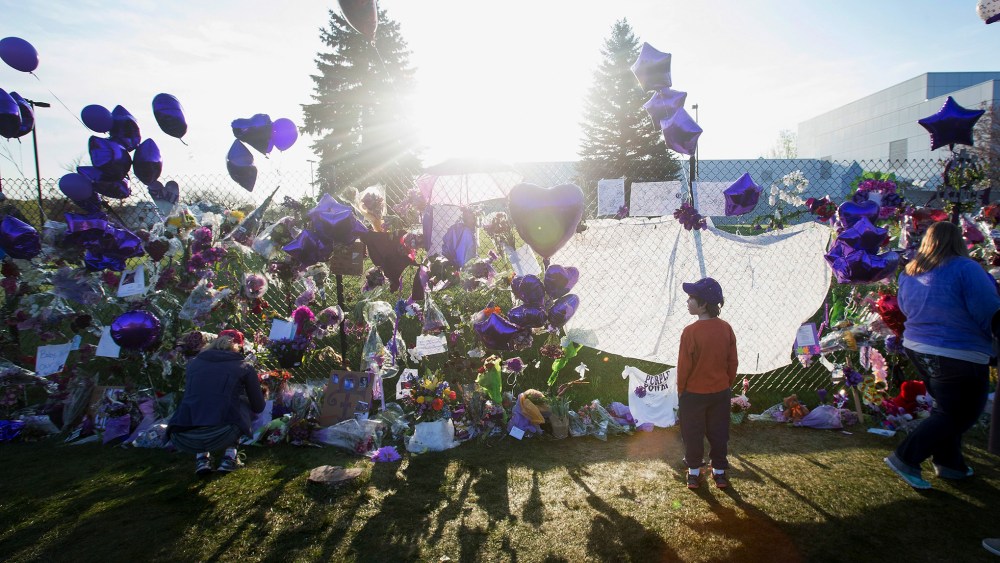 Music fans visit a memorial created outside Paisley Park, the home and studio of Prince, on April 23, 2016 in Chanhassen, Minn. (Photo by Scott Olson/Getty)