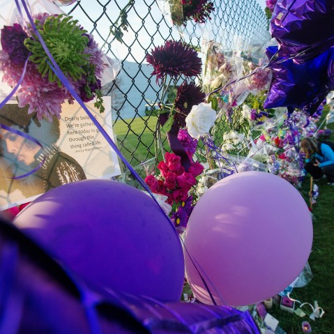 Mementos left by fans are attached to the fence which surrounds Paisley Park, the home and studio of Prince, on April 23, 2016 in Chanhassen, Minn. (Photo by Scott Olson/Getty)