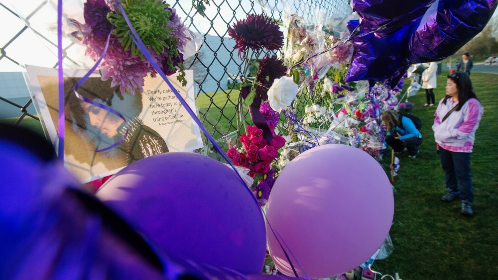 Mementos left by fans are attached to the fence which surrounds Paisley Park, the home and studio of Prince, on April 23, 2016 in Chanhassen, Minn. (Photo by Scott Olson/Getty)