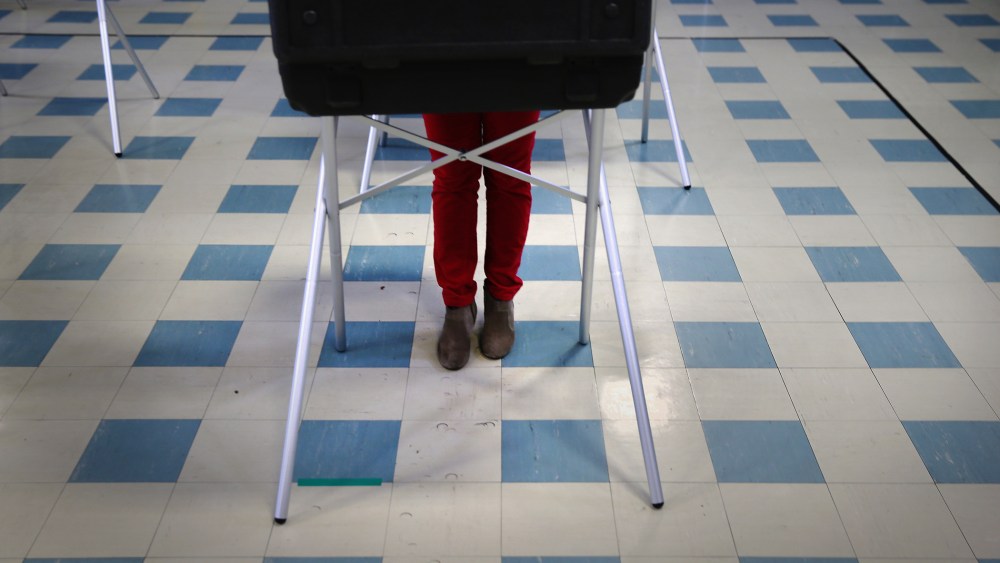 A voter fills out her ballot at a polling center on April 26, 2016 in Stamford, Conn. (Photo by John Moore/Getty)