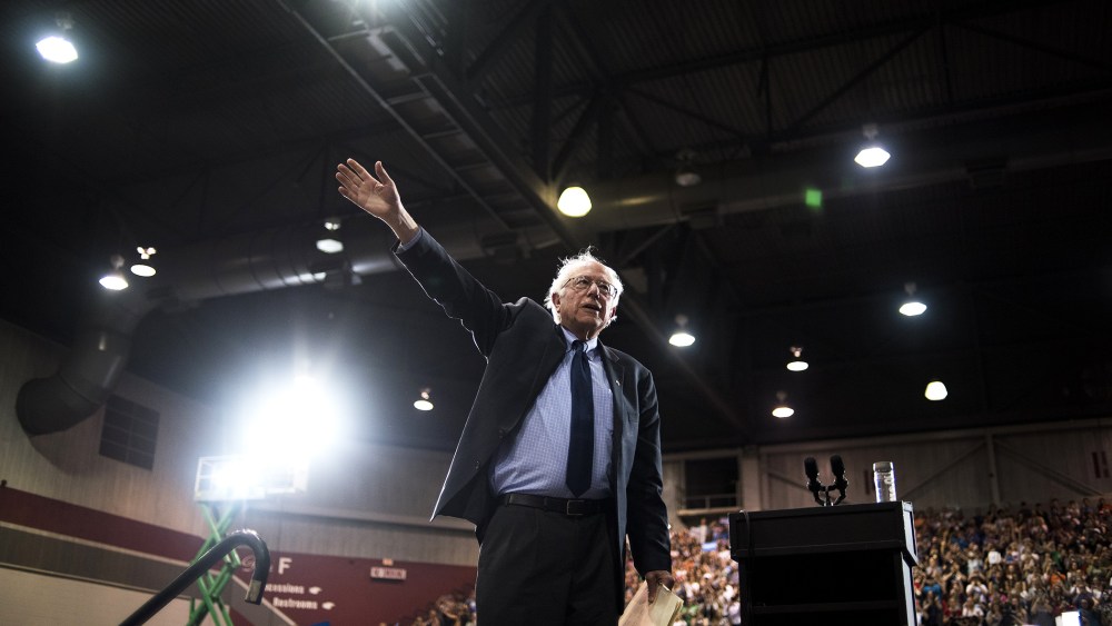 Democratic presidential candidate Senator Bernie Sanders (I-Vt.) waves at attendees during a campaign event in Huntington, W. Va., on April 26, 2016. (Photo by Ty Wright/Bloomberg/Getty)
