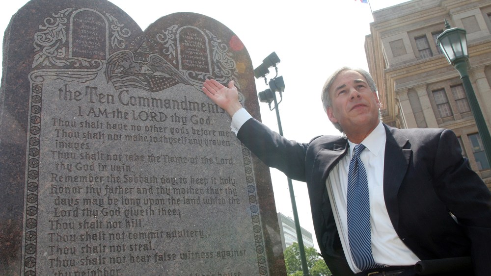 Texas Attorney General Greg Abbott attends a press conference celebrating the U.S. Supreme Court decision that allows a Ten Commandments monument to stand outside the Texas State Capitol in Austin, Texas on Jun. 27, 2005 (Photo by Jana Birchum/Getty).