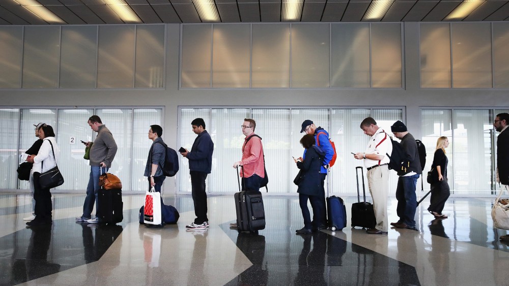 Passengers at O'Hare International Airport wait in line to be screened at a Transportation Security Administration (TSA) checkpoint on May 16, 2016 in Chicago, Ill. (Photo by Scott Olson/Getty)