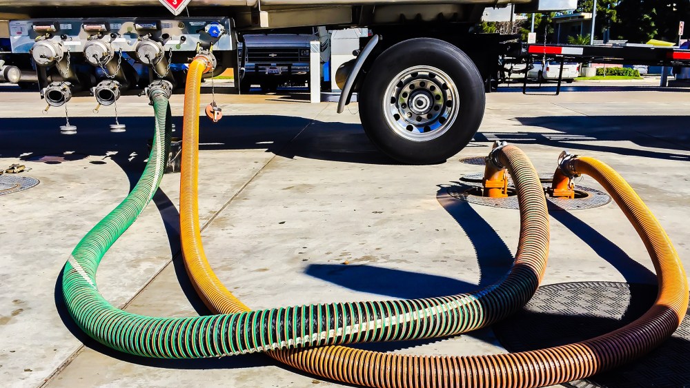 A gasoline tanker distributes gasoline to underground gasoline tanks in Venice, Calif., Jan. 24, 2015. (Photo by  Bob Berg/Getty)