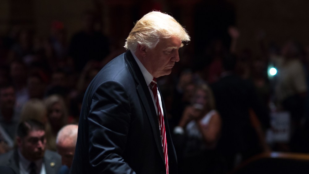 Republican presidential candidate Donald Trump walks on stage after signing autographs during a campaign stop at The Fox Theatre on June 15, 2016 in Atlanta, Ga. (Photo by Branden Camp/Getty)