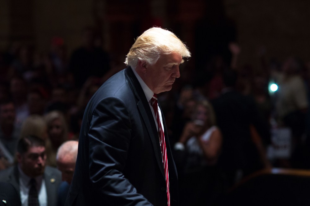 Republican presidential candidate Donald Trump walks on stage after signing autographs during a campaign stop at The Fox Theatre on June 15, 2016 in Atlanta, Ga. (Photo by Branden Camp/Getty)