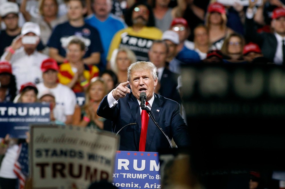 Republican presidential candidate Donald Trump speaks to a crowd of supporters during a campaign rally on June 18, 2016 in Phoenix, Ariz. (Photo by Ralph Freso/Getty)