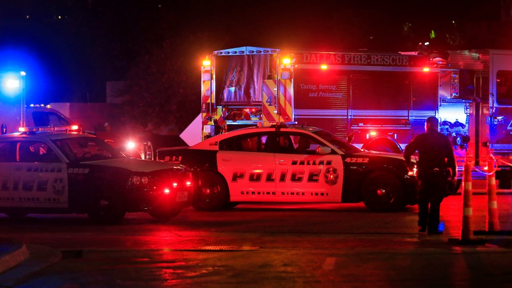Dallas police work near the scene where eleven Dallas police officers were shot and five have now died on July 8, 2016 in Dallas, Texas. (Photo by Ron Jenkins/Getty)