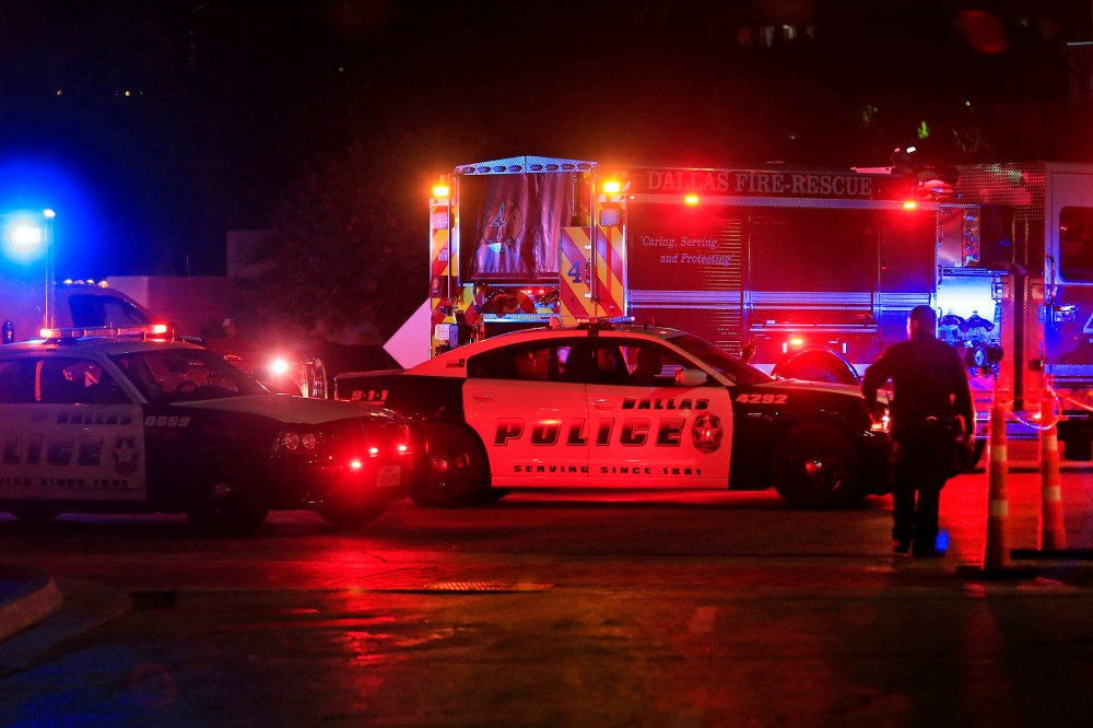 Dallas police work near the scene where eleven Dallas police officers were shot and five have now died on July 8, 2016 in Dallas, Texas. (Photo by Ron Jenkins/Getty)