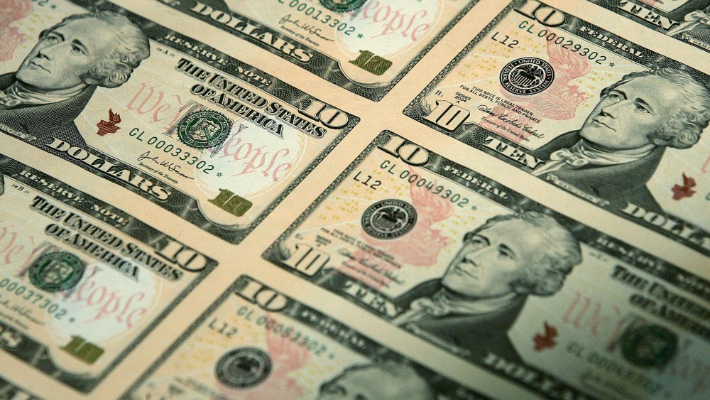 An uncut sheet of the $10 bill is seen. (Photo by Alex Wong/Getty)