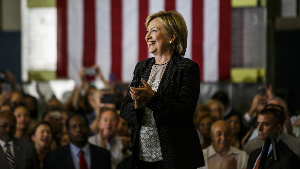 Hillary Clinton, 2016 Democratic presidential nominee, smiles before speaking during a campaign event in Warren, Mich., Aug. 11, 2016. (Photo by Sean Proctor/Bloomberg/Getty)