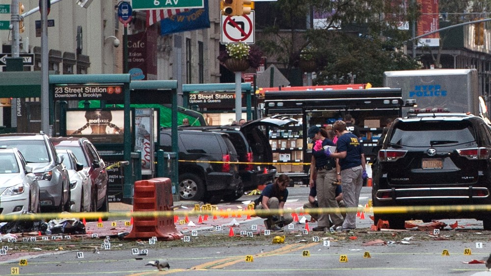 FBI agents review the crime scene of remnants of bomb debris on 23rd St. in Manhattan's Chelsea neighborhood on Sept. 18, 2016 in New York City. (Photo by Stephanie Keith/Getty)
