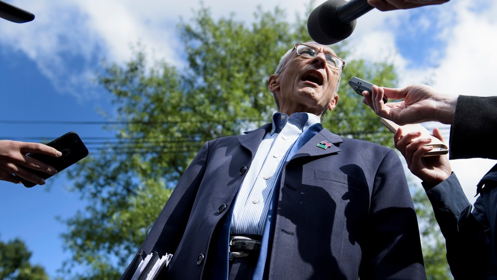 John Podesta, Clinton Campaign Chairman, talks to reporters as he walks to Democratic presidential nominee Hillary Clinton's Washington DC home, Oct. 5, 2016. (Photo by Brendan Smialowski/AFP/Getty)