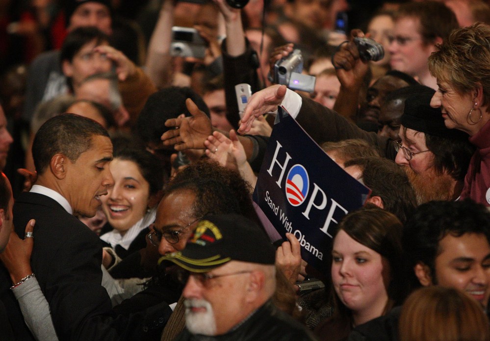 Then-Democratic Presidential hopeful Senator Barack Obama (D-IL) greets supporters gathered for a post-caucus celebration at the Hy-Vee Center, Jan. 3, 2008 in Des Moines, Ia. (Photo by Scott Olson/Getty)
