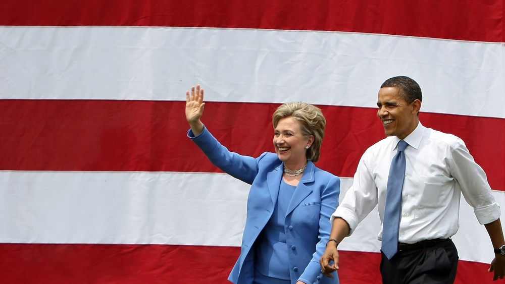 Democratic presidential candidate Sen. Barack Obama (D-IL) and Sen. Hillary Rodham Clinton (D-NY) wave to the crowd June 27, 2008 in Unity, N.H. (Photo by Mario Tama/Getty)
