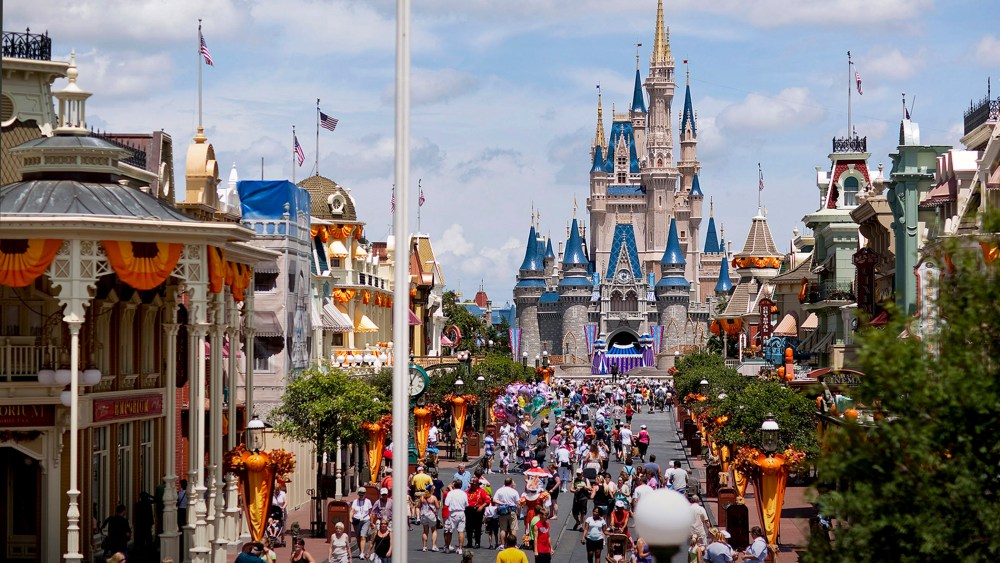 Visitors make their way toward Cinderella Castle at Magic Kingdom, at the Walt Disney World theme park and resort in Lake Buena Vista, Florida.  (Photo by Matt Stroshane/Bloomberg/Getty)