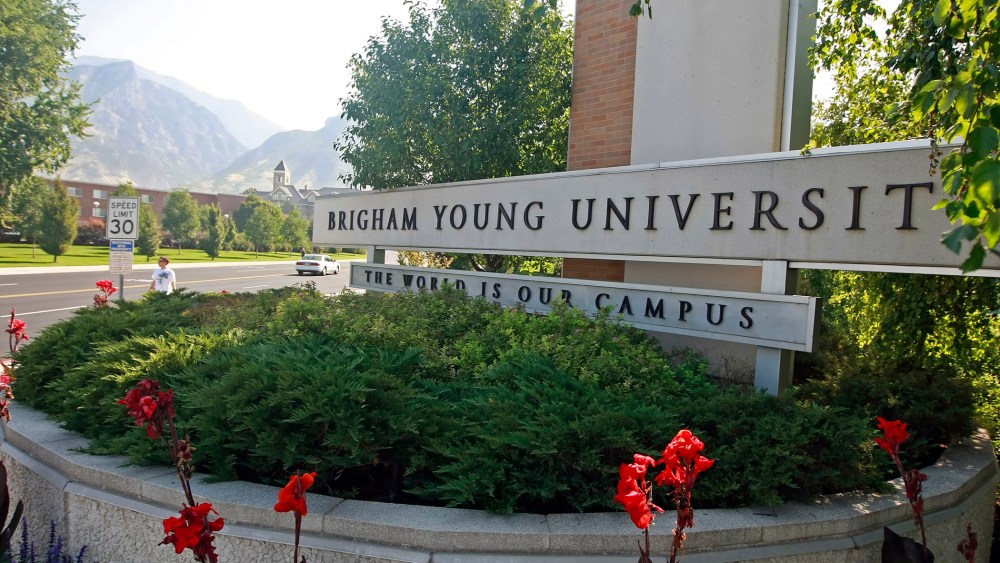 Cars and people make their way past the enterance of Brigham Young University in Provo, Utah. (Photo by George Frey/Bloomberg/Getty)