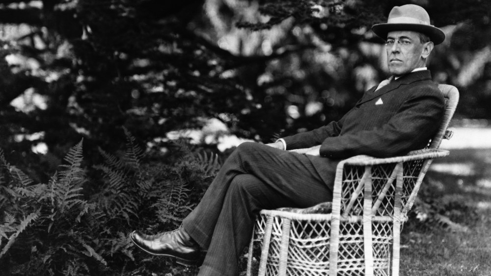 Full length portrait of American President Woodrow Wilson seated outdoors, circa 1920. (Photo by Fotosearch/Getty)