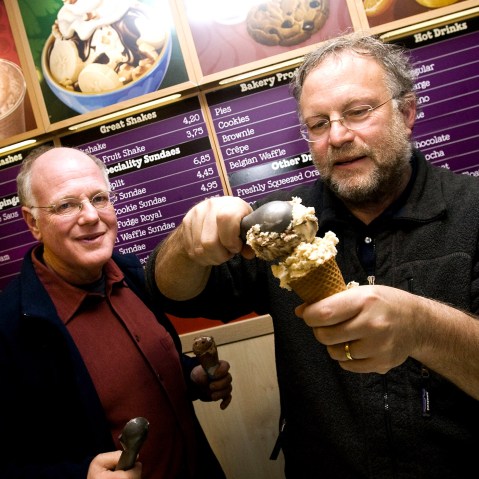 American ice cream makers Ben Cohen and Jerry Greenfield, founders of the brandBen & Jerry's, give out ice creams for free in their shop, Feb. 22, 2010. (Photo by Ade Johnson/AFP/Getty)