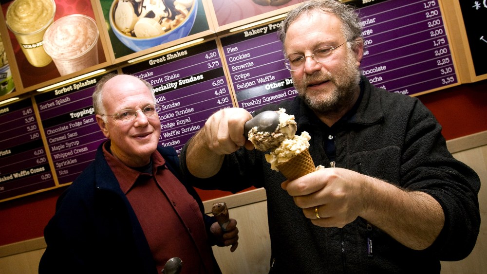 American ice cream makers Ben Cohen and Jerry Greenfield, founders of the brandBen & Jerry's, give out ice creams for free in their shop, Feb. 22, 2010. (Photo by Ade Johnson/AFP/Getty)
