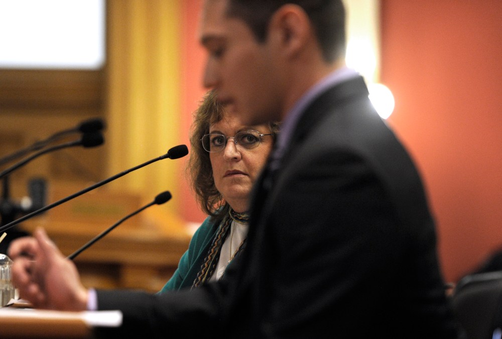 Colorado State Senator Evie Hudak, D-Westminster, left, listens to testimony in the Colorado State Senate in Denver on March 4, 2013.