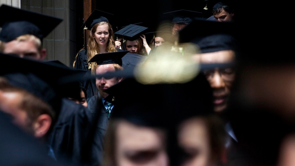 New graduates walk out of the chapel after their commencement at Princeton University in Princeton, New Jersey, U.S., on June 2, 2013.