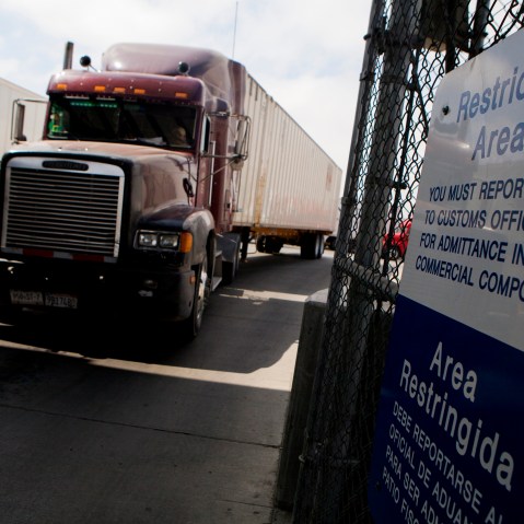 Truck drivers wait to speak to a US Customs and Border Protection officer soon after arriving in the US from Mexico at the Otay Mesa Port of Entry cargo facility in San Diego, Calif., June 7, 2013. (Photo by Sam Hodgson/Bloomberg via Getty)